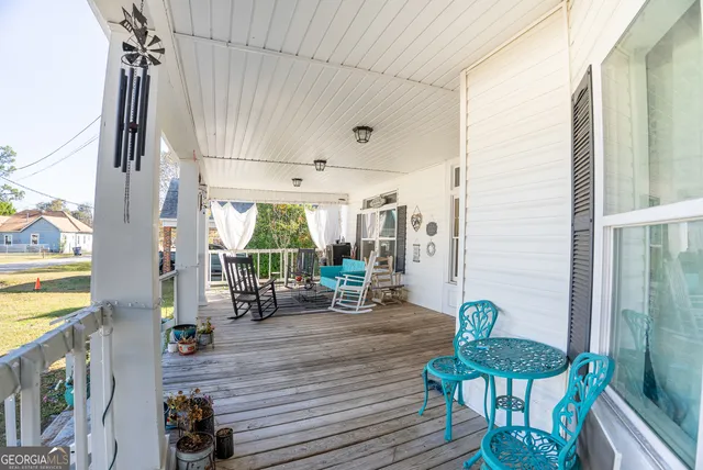 a view of a living room and balcony