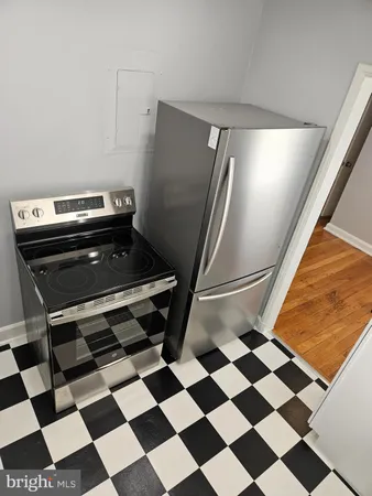 a room with a black white checkered floor and a black white checkered floor