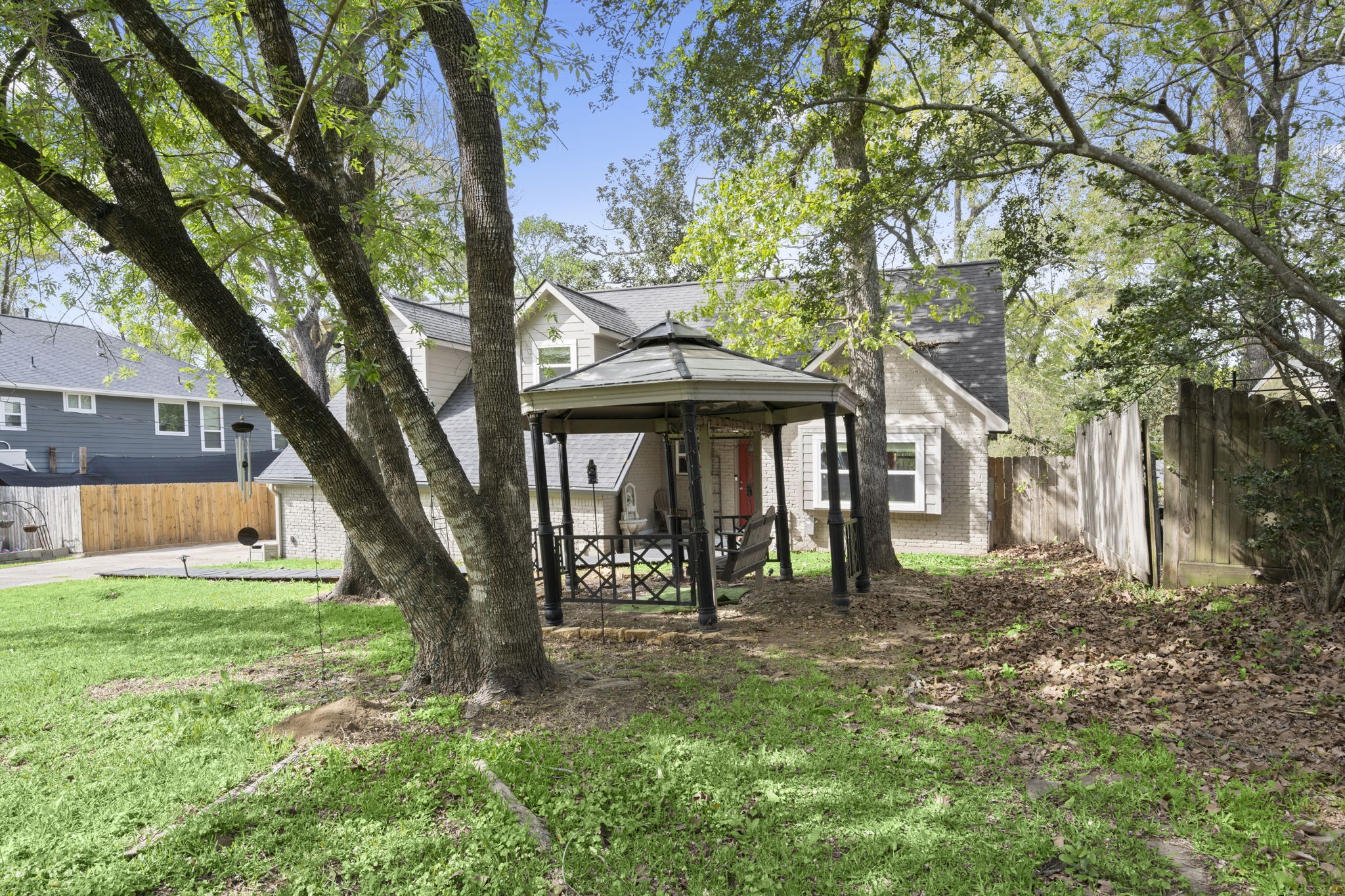 3414 Rustling Pines Street Spring, TX 77380 - Photo 4 of 26 a front view of a house with yard and green space