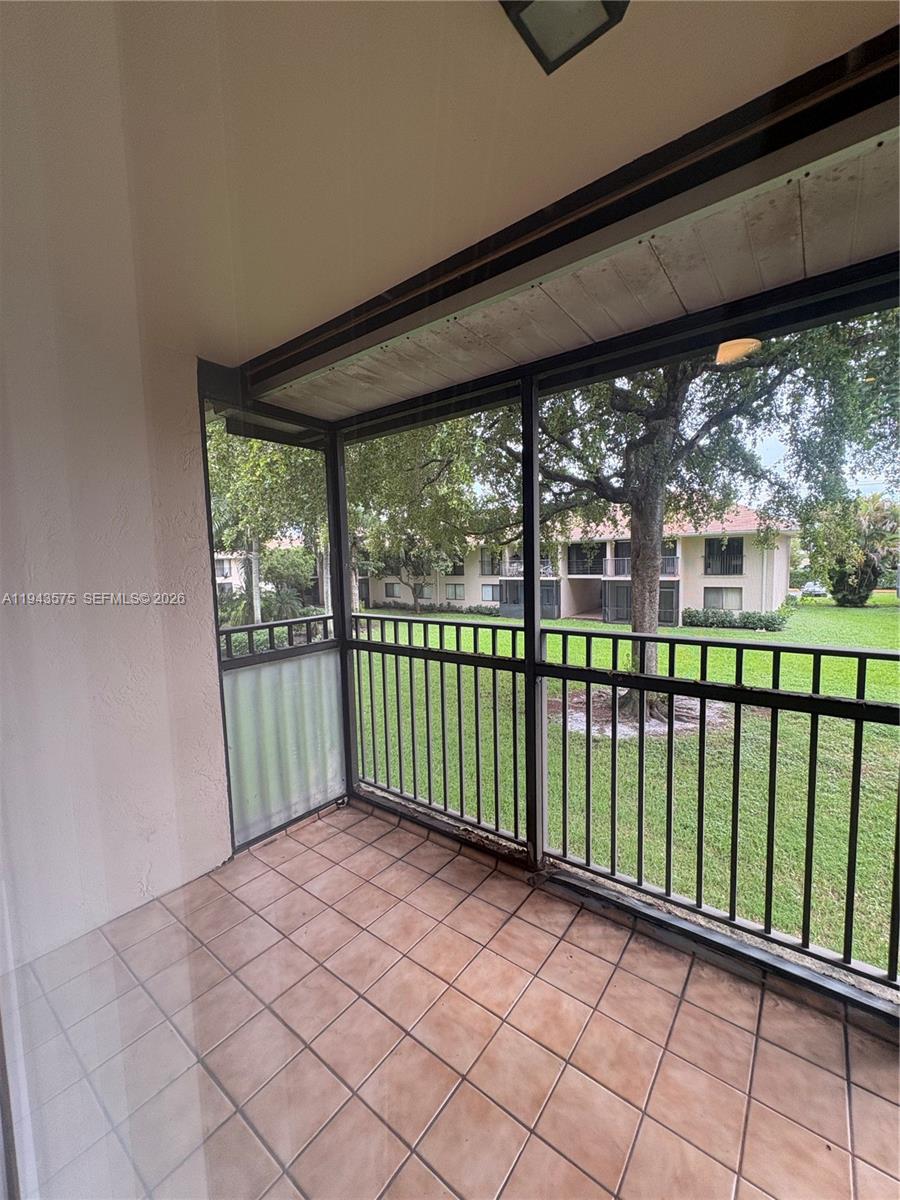 5981 Washington Street, Unit 215 Hollywood, FL 33023 - Photo 15 of 24 a view of a black and white umbrella