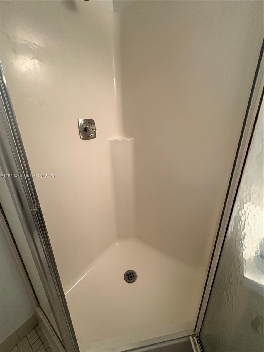 5981 Washington Street, Unit 215 Hollywood, FL 33023 - Photo 18 of 24 a bathroom with a shower