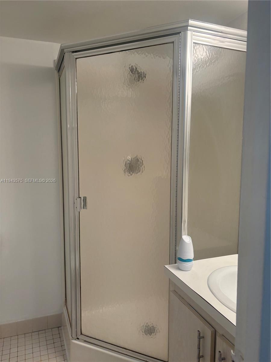5981 Washington Street, Unit 215 Hollywood, FL 33023 - Photo 19 of 24 a bathroom with a shower and sink
