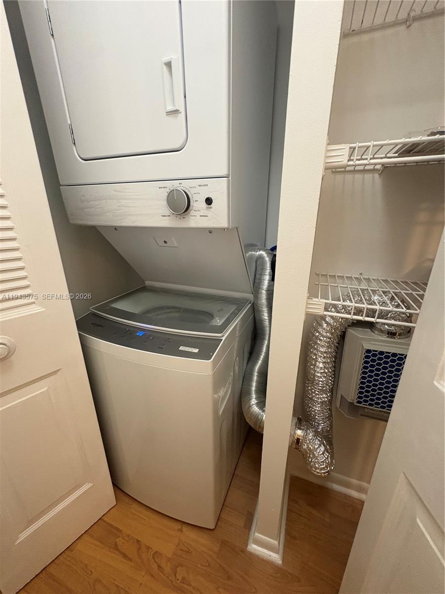 5981 Washington Street, Unit 215 Hollywood, FL 33023 - Photo 2 of 24 a utility room with dryer and washer