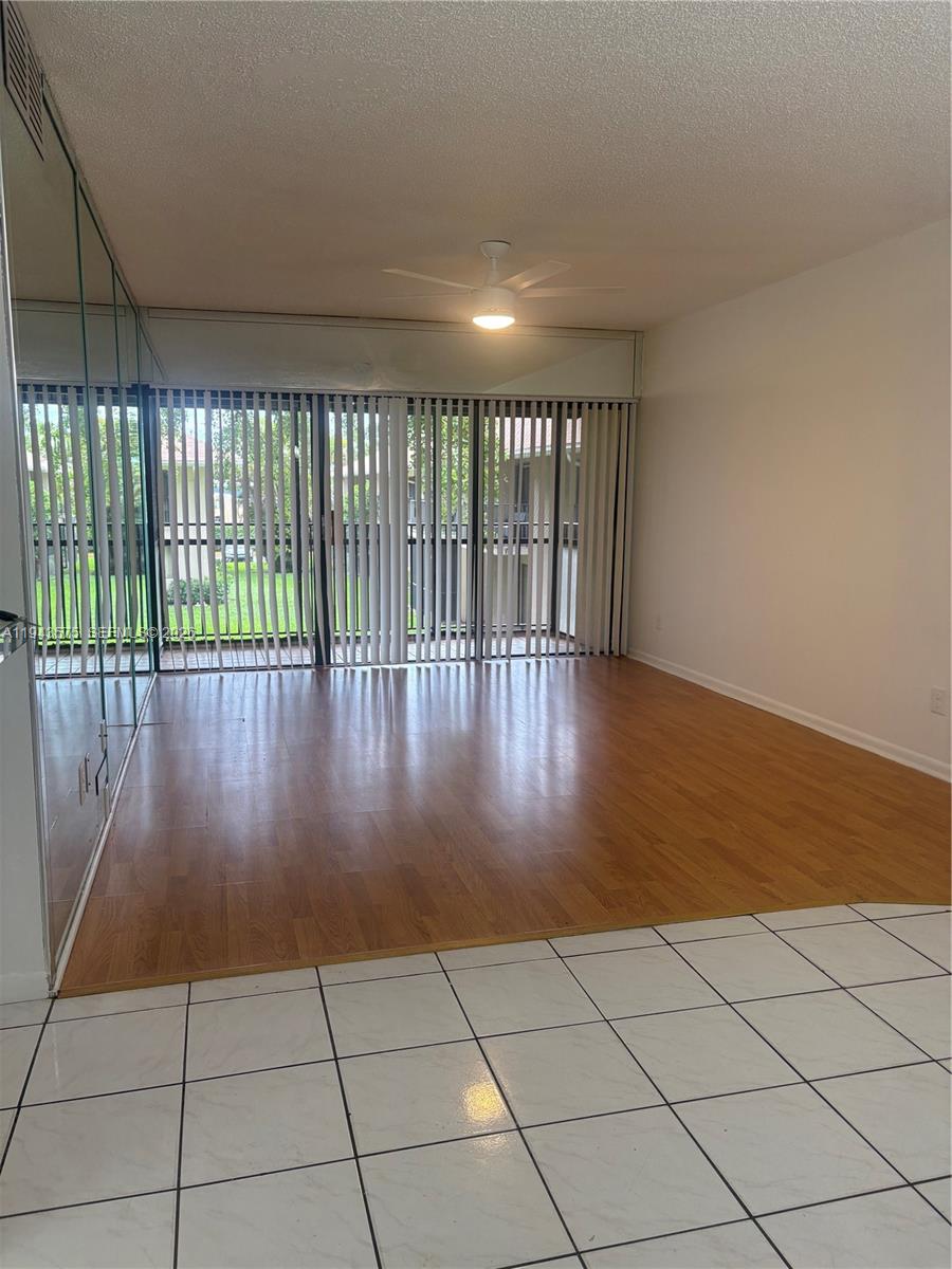 5981 Washington Street, Unit 215 Hollywood, FL 33023 - Photo 7 of 24 a view of entryway with wooden floor