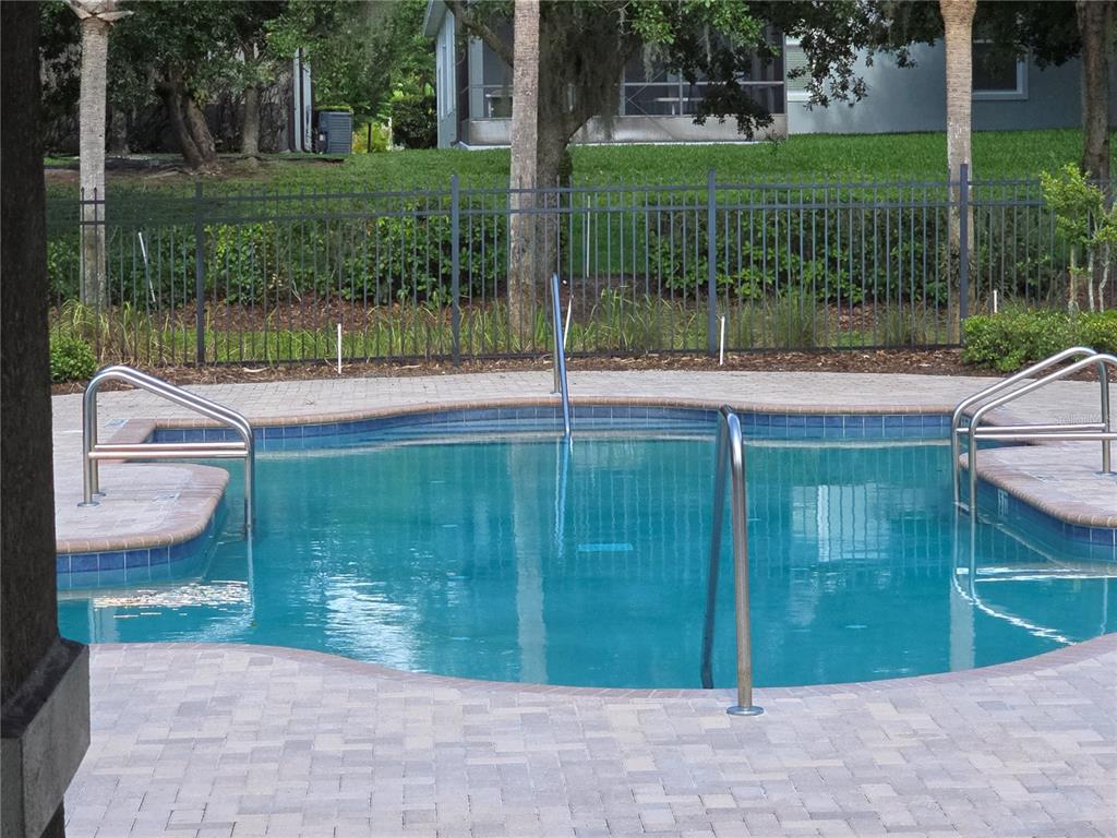 7180 Beek Street Windermere, FL 34786 - Photo 29 of 33 a view of a house with a backyard and a garden