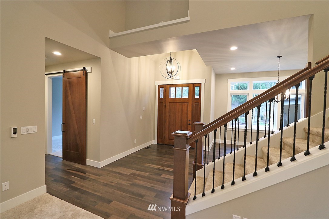 8826 Goshawk Road Blaine, WA 98230 - Photo 3 of 24 a view of staircase with railing and stairs