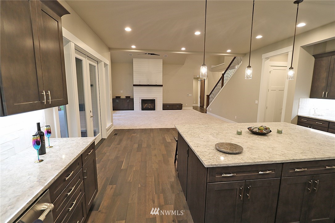 8826 Goshawk Road Blaine, WA 98230 - Photo 9 of 24 a kitchen with a sink a stove and cabinets