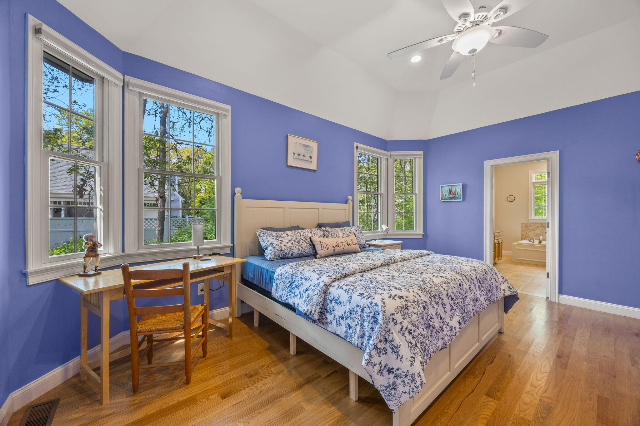 17 Payamps Road Mashpee, MA 02649 - Photo 41 of 72 a bedroom with a bed and a table in it with wooden floor