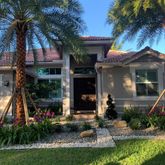 a front view of a house with garden