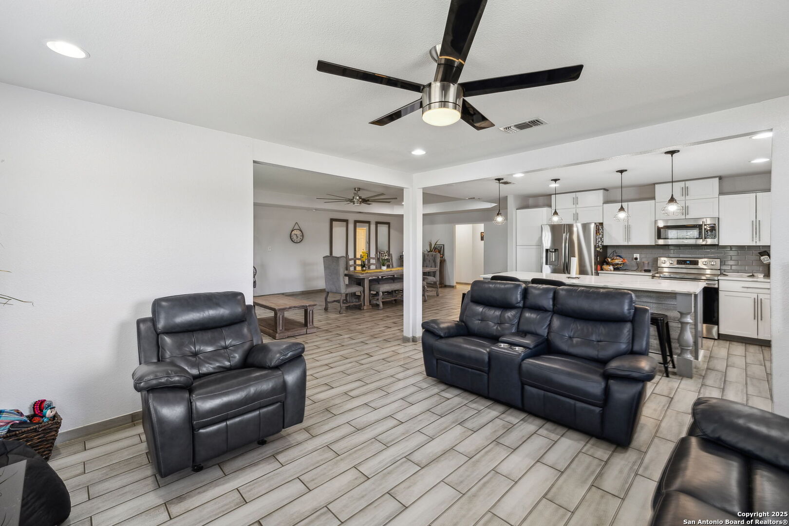 2355 Stuart Road Adkins, TX 78101 - Photo 16 of 46 a living room with furniture and a ceiling fan