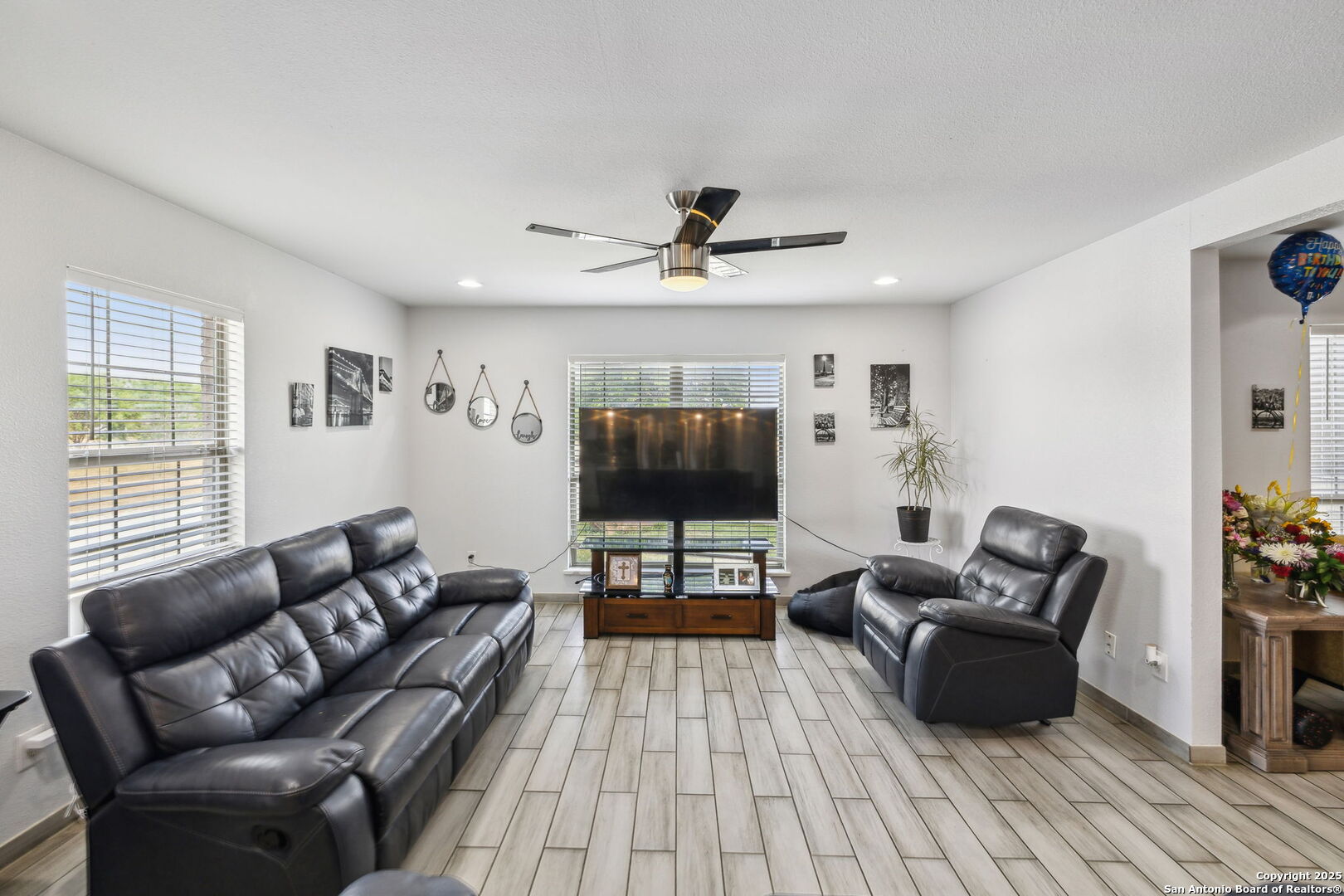2355 Stuart Road Adkins, TX 78101 - Photo 17 of 46 a living room with furniture and a flat screen tv