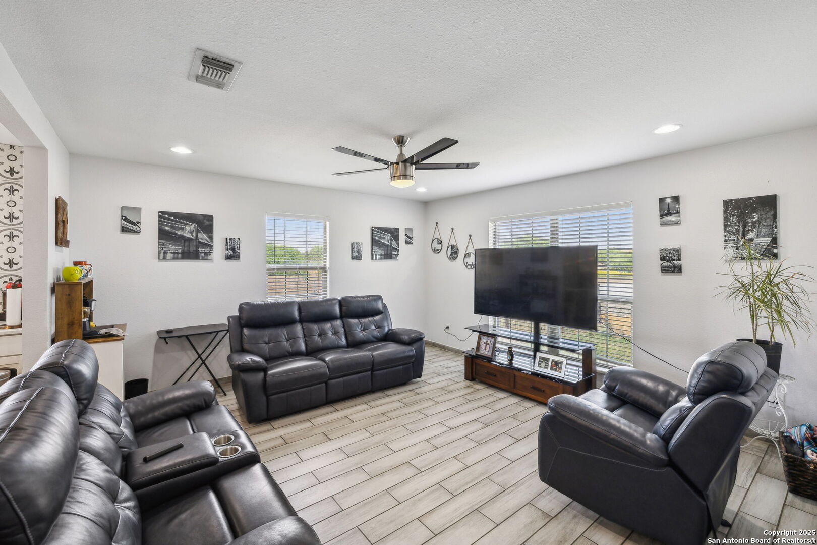 2355 Stuart Road Adkins, TX 78101 - Photo 18 of 46 a living room with furniture and a flat screen tv