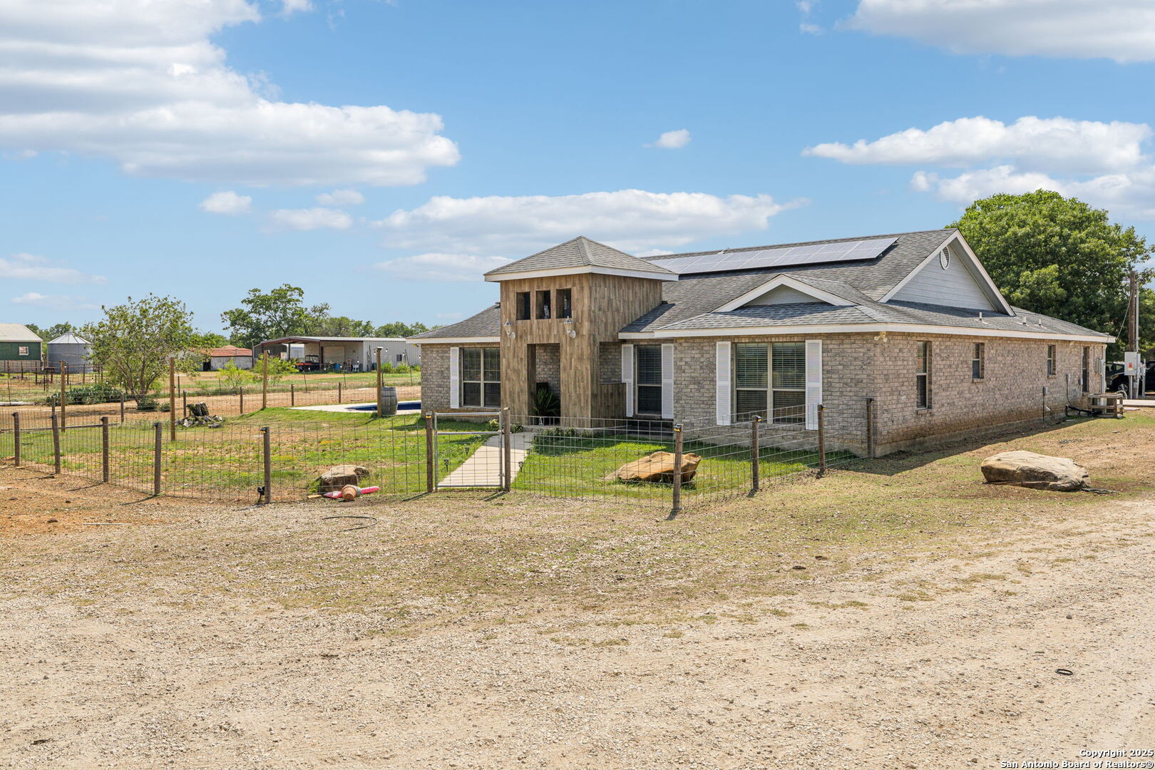 2355 Stuart Road Adkins, TX 78101 - Photo 2 of 46 a view of a house with backyard and a tree