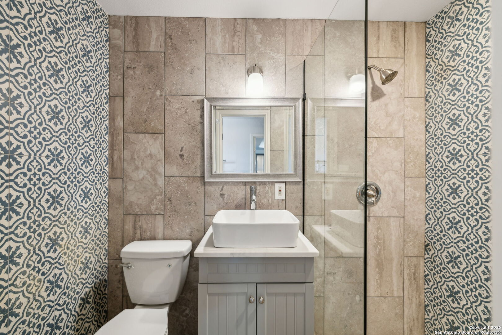 2355 Stuart Road Adkins, TX 78101 - Photo 21 of 46 a bathroom with a sink toilet and shower