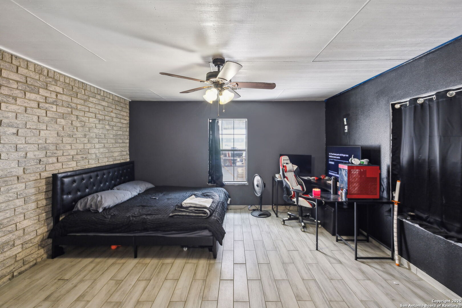 2355 Stuart Road Adkins, TX 78101 - Photo 27 of 46 a living room with furniture and a wooden floor