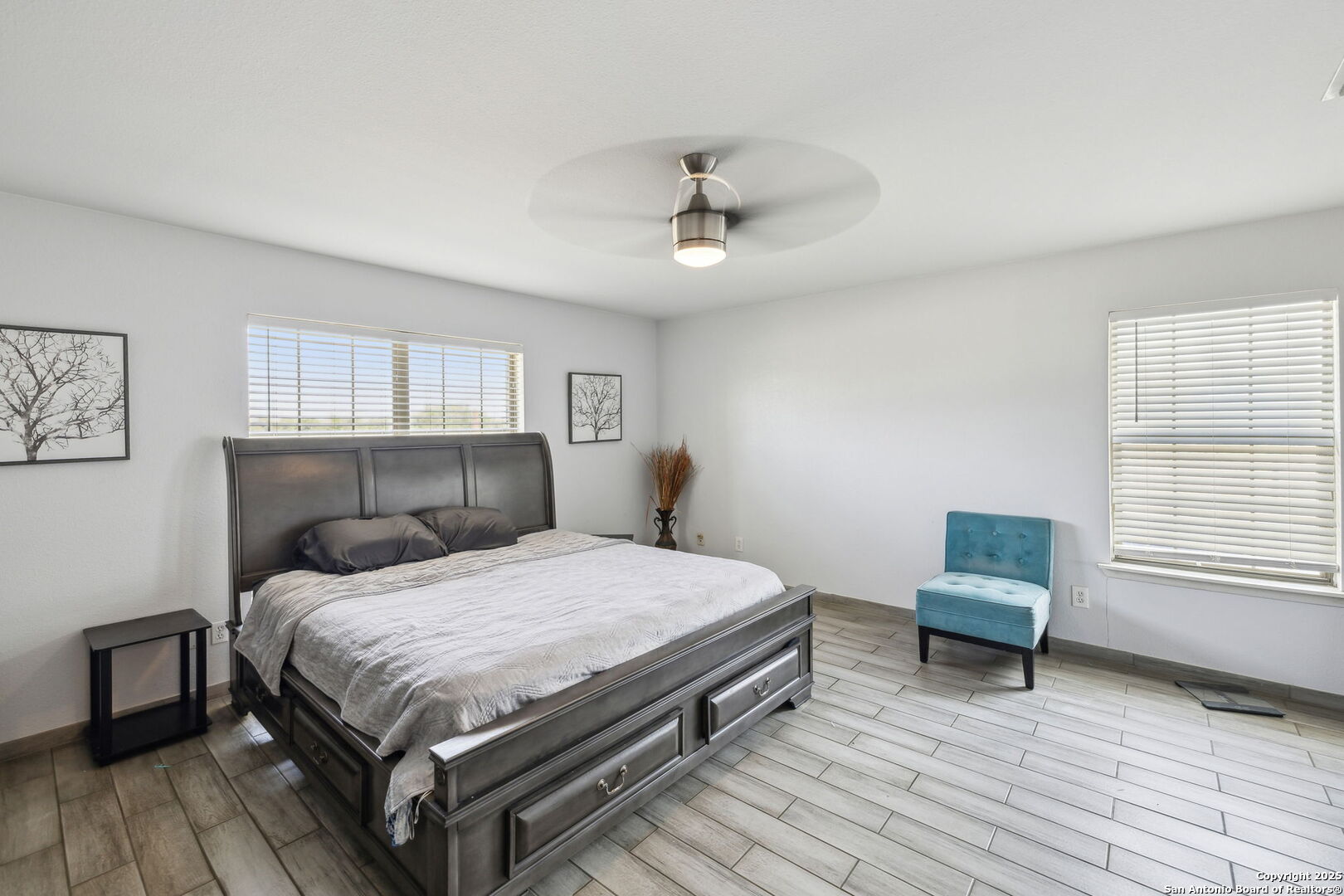 2355 Stuart Road Adkins, TX 78101 - Photo 29 of 46 a bedroom with a bed and a chair