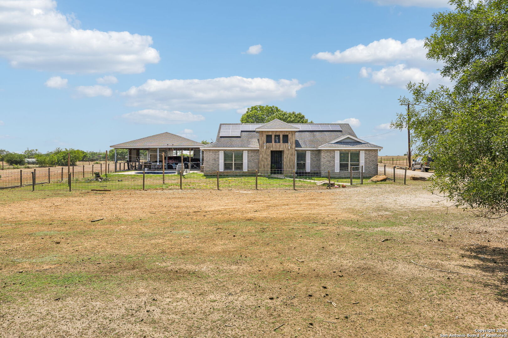 2355 Stuart Road Adkins, TX 78101 - Photo 31 of 46 a front view of a house with a yard and lake view