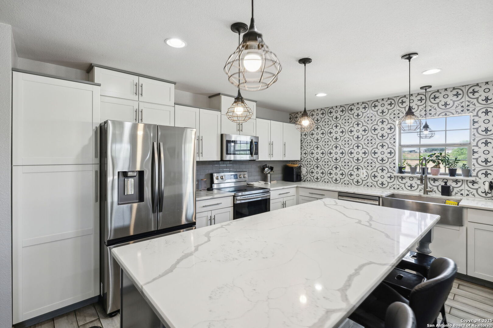 2355 Stuart Road Adkins, TX 78101 - Photo 8 of 46 a kitchen with refrigerator a sink and cabinets