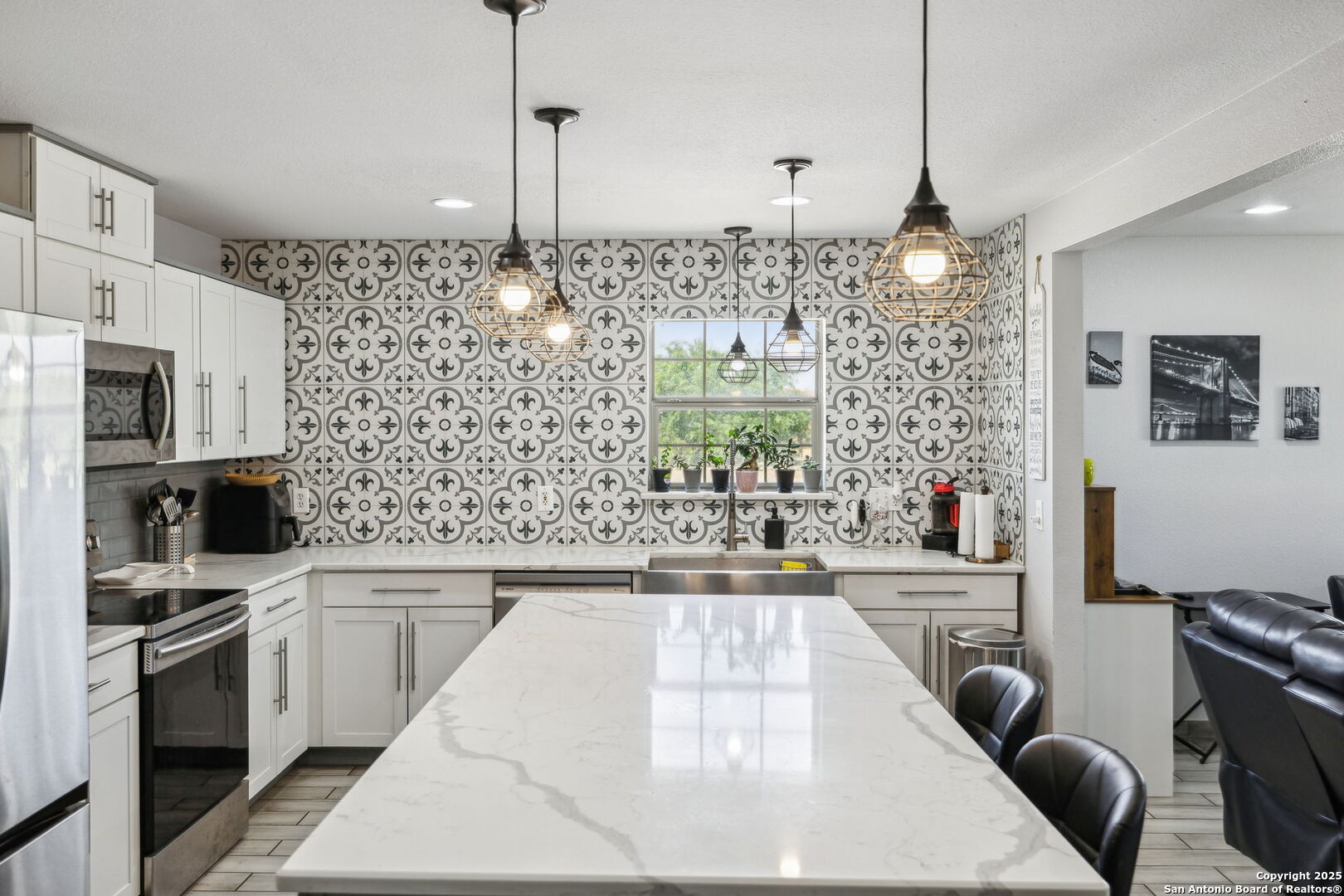 2355 Stuart Road Adkins, TX 78101 - Photo 9 of 46 a kitchen with stainless steel appliances kitchen island granite countertop a stove and a sink with granite countertops