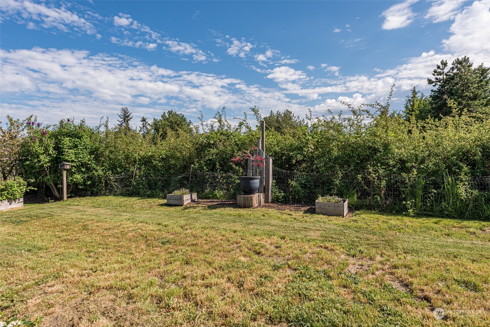 590 Kitchen-Dick Road Sequim, WA 98382 - Photo 27 of 40 a backyard of a house with lots of green space