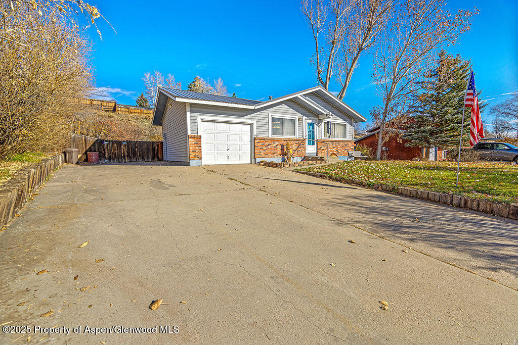 834 Ashley Road Craig, CO 81625 - Photo 2 of 38 a front view of a house with a yard