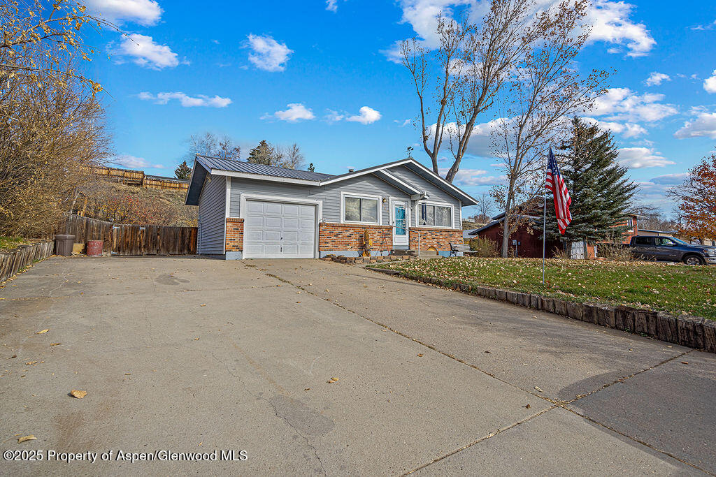 834 Ashley Road Craig, CO 81625 - Photo 3 of 38 a front view of a house with a yard