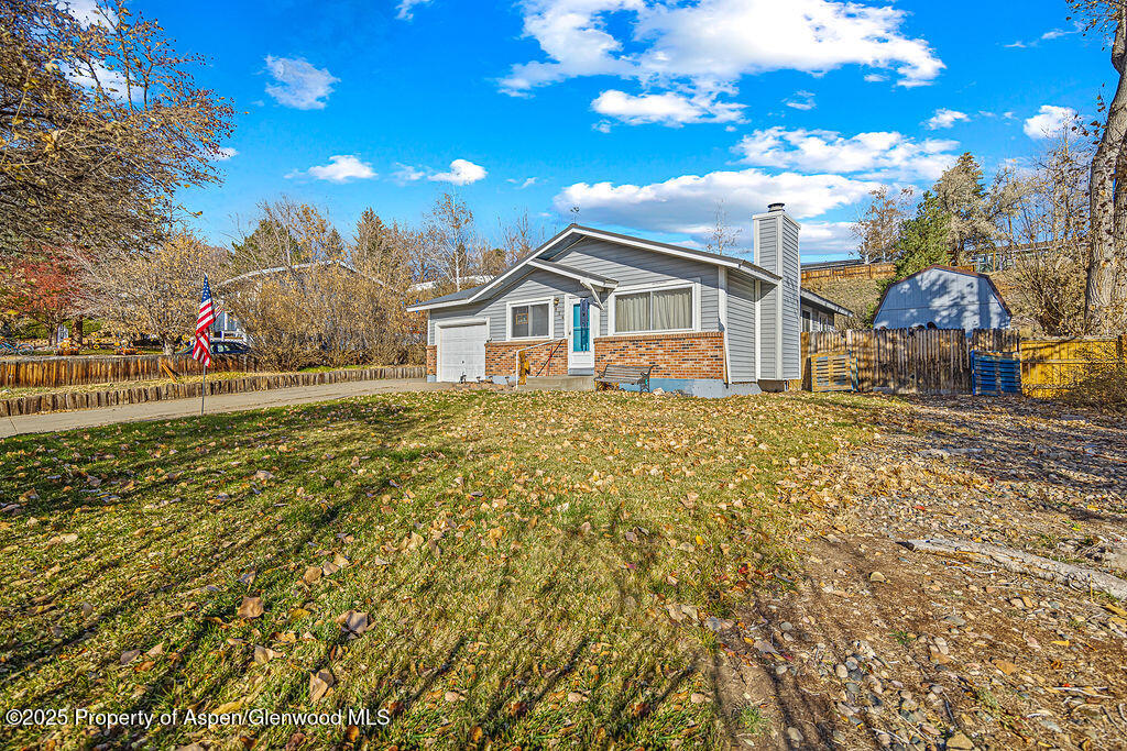 834 Ashley Road Craig, CO 81625 - Photo 33 of 38 a view of a house with a yard