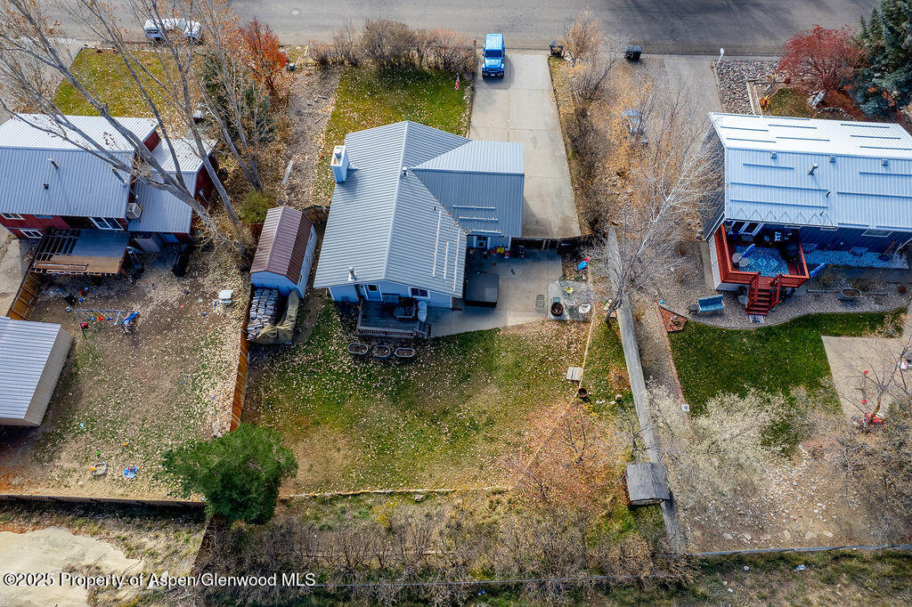 834 Ashley Road Craig, CO 81625 - Photo 36 of 38 a aerial view of a house with swimming pool and a yard