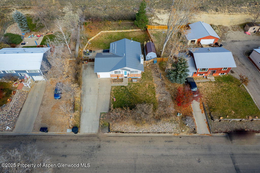 834 Ashley Road Craig, CO 81625 - Photo 38 of 38 an aerial view of a house with a yard and large tree