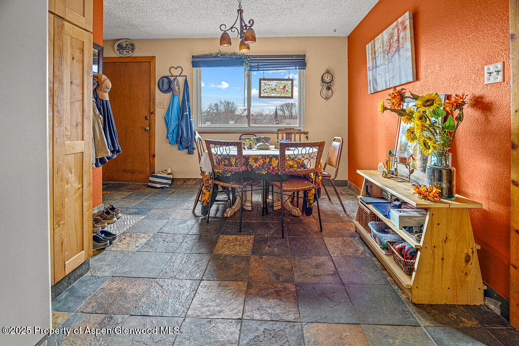 834 Ashley Road Craig, CO 81625 - Photo 5 of 38 a dining room with furniture and a window