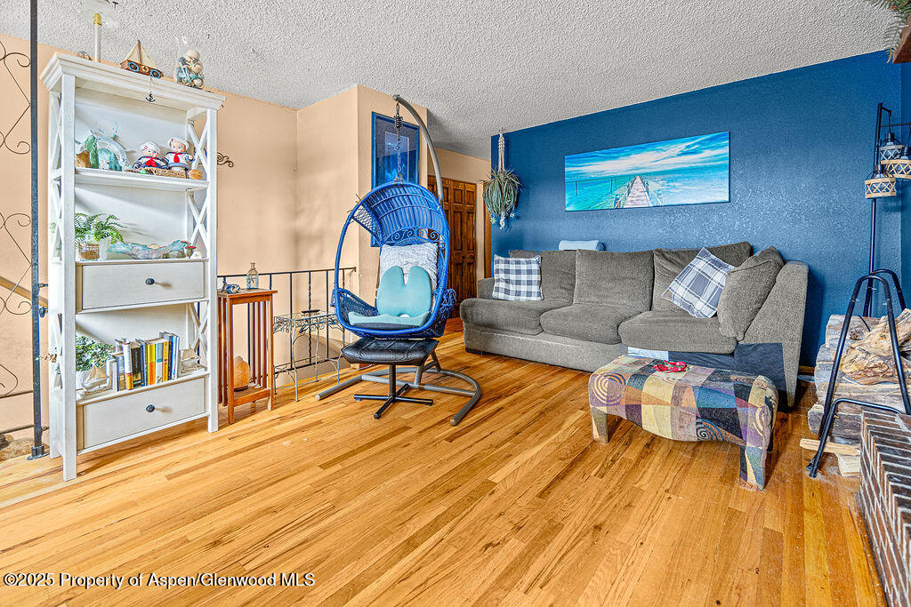 834 Ashley Road Craig, CO 81625 - Photo 7 of 38 a living room with furniture and a wooden floor