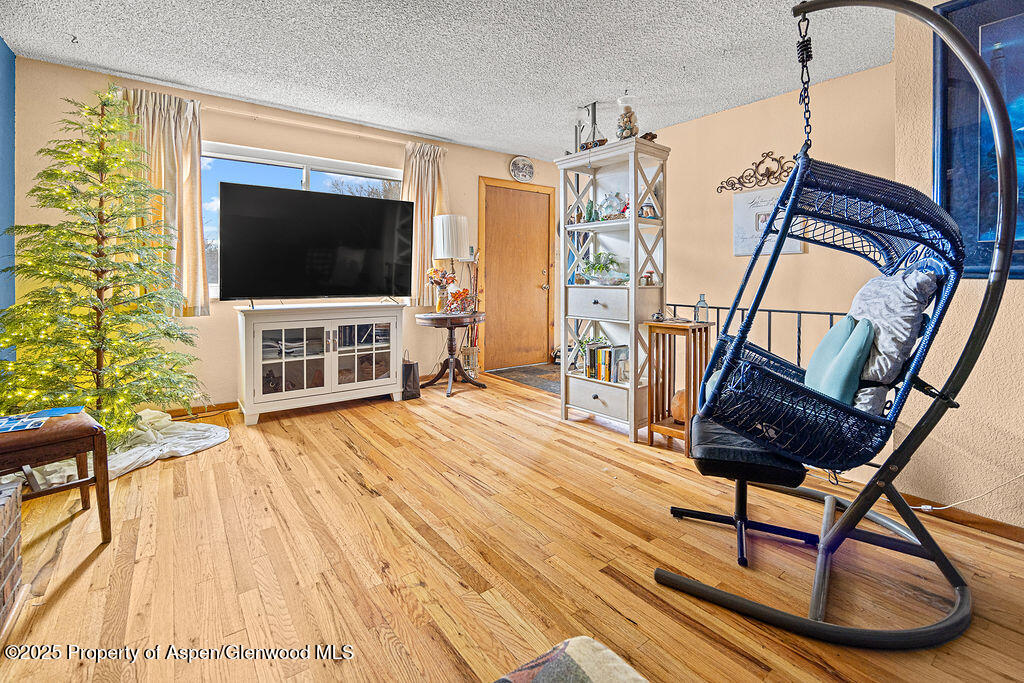 834 Ashley Road Craig, CO 81625 - Photo 8 of 38 a view of a livingroom with furniture and hardwood floor