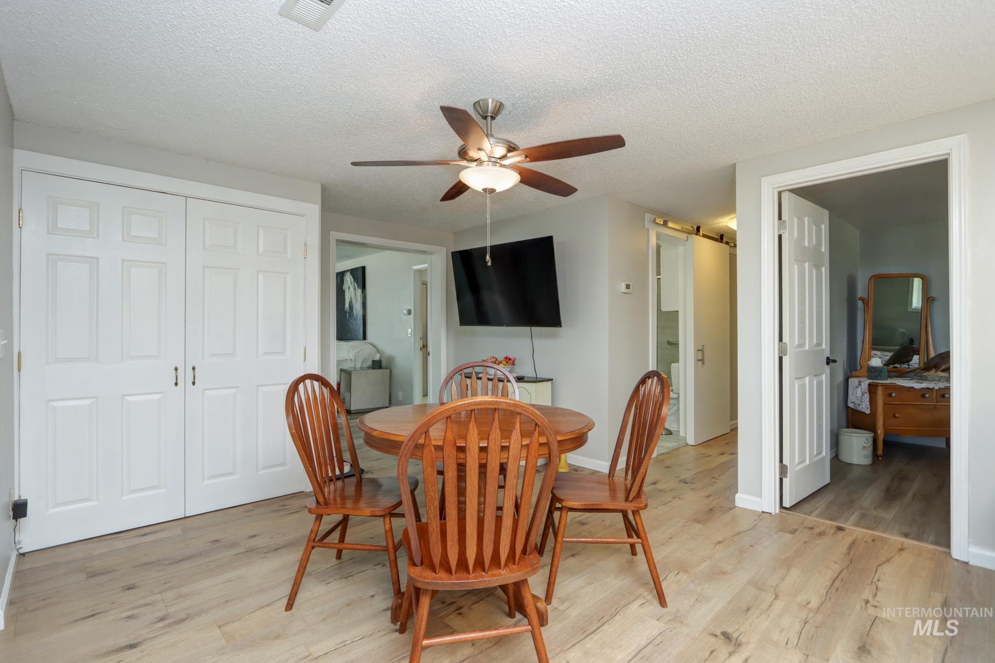 2528 Waterwheel Road Emmett, ID 83617 - Photo 24 of 50 Interior room featuring light gray walls, wood-finish flooring, and a ceiling fan with integrated lighting