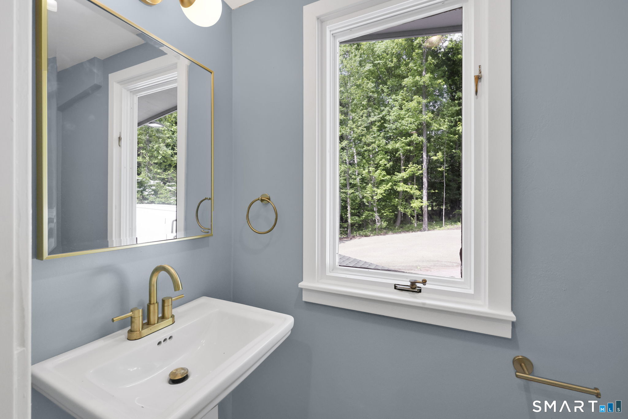 49 Millstone Road Glastonbury, CT 06033 - Photo 19 of 39 a bathroom with a sink and a mirror