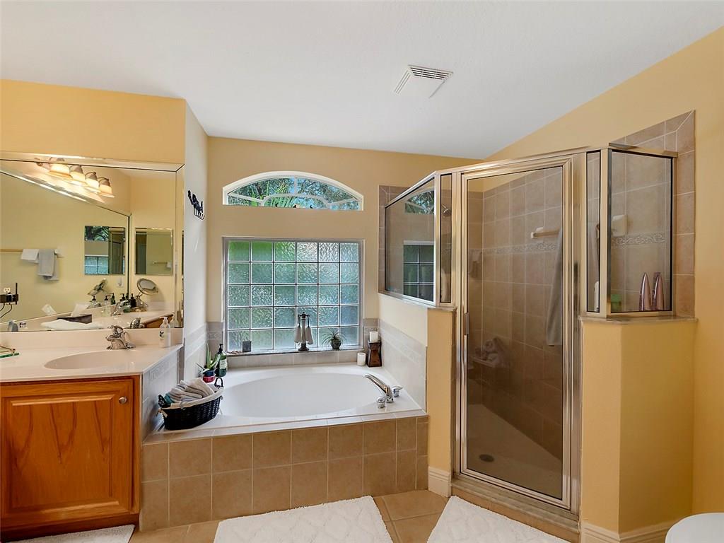 1945 Southwest Panther Trace Stuart, FL 34997 - Photo 10 of 18 a very nice looking room with a large window and chandelier