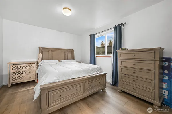 a bedroom with a bed and cabinets