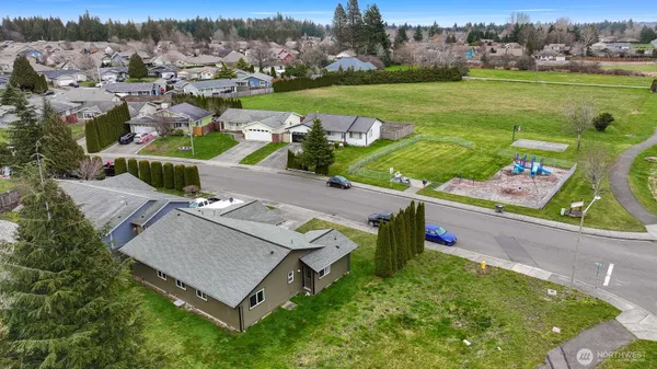 an aerial view of a house with outdoor space