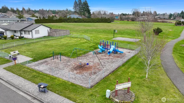 an aerial view of a house with outdoor space