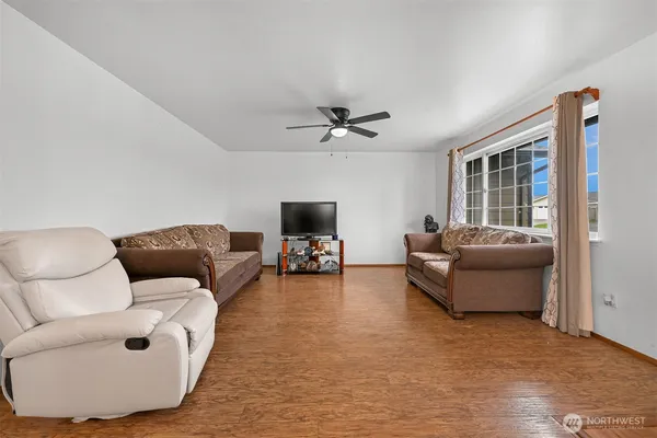 a living room with furniture and a window
