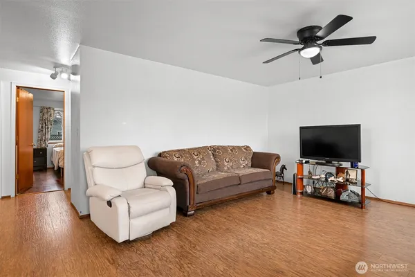 a living room with furniture and a flat screen tv