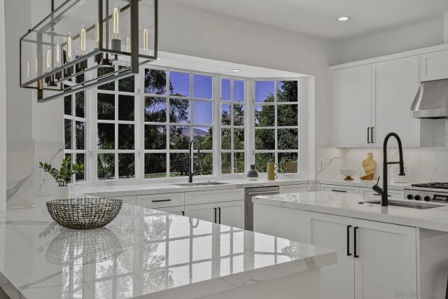 a living room with a flat screen tv and furniture