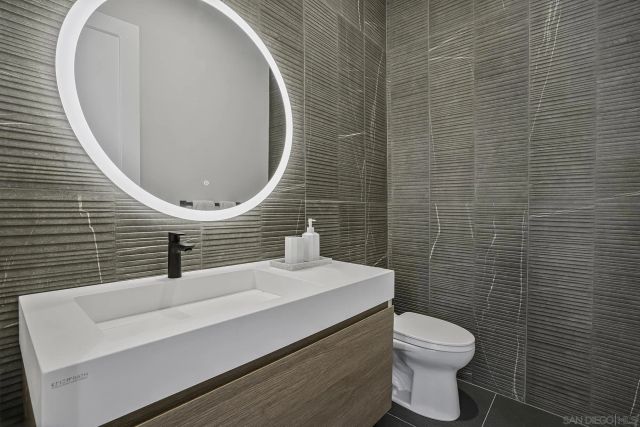 a white bath tub sitting next to a window