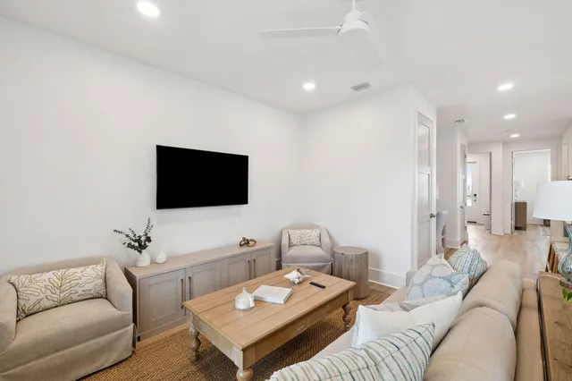 a bathroom with a toilet sink vanity and mirror
