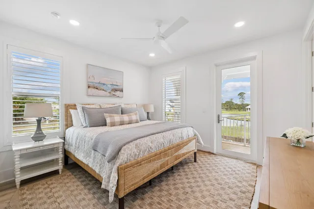 a bedroom with two beds and a night stand