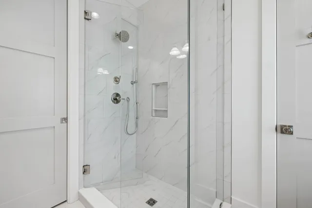 an aerial view of a house with a yard basket ball court and outdoor seating