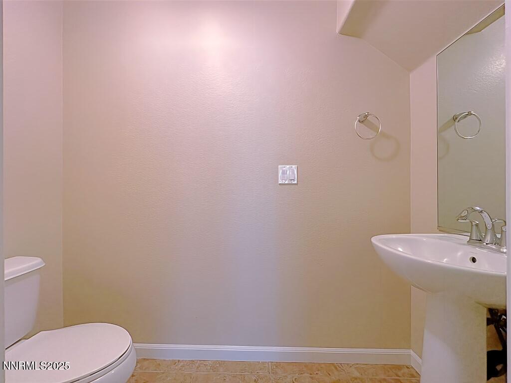2180 Alamo Square Way Reno, NV 89509 - Photo 11 of 34 a bathroom with a sink a toilet and mirror