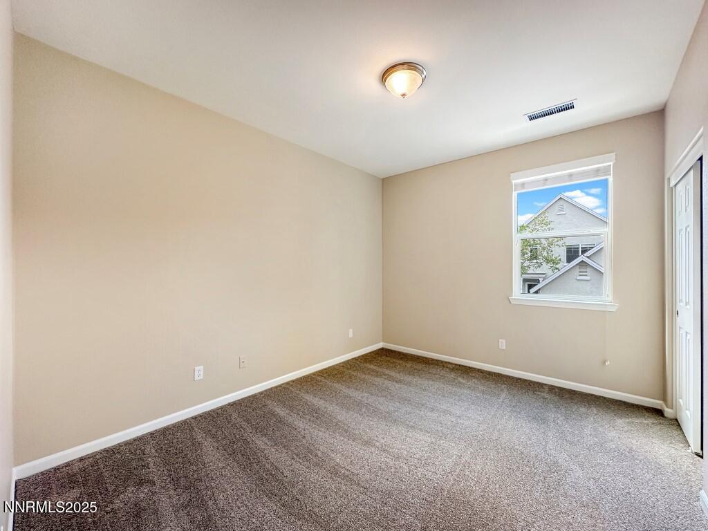 2180 Alamo Square Way Reno, NV 89509 - Photo 22 of 34 an empty room with windows