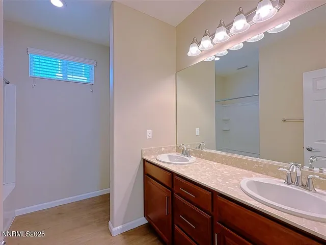 a bedroom with a bed and lamp with window