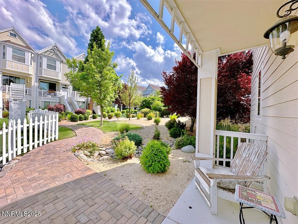 2180 Alamo Square Way Reno, NV 89509 - Photo 3 of 34 a view of a patio with couches table and chairs and potted plants