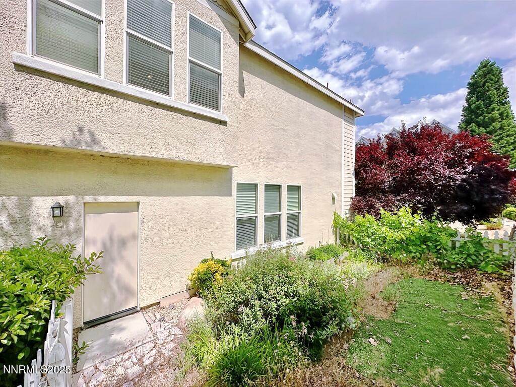 2180 Alamo Square Way Reno, NV 89509 - Photo 33 of 34 front view of a house with a yard